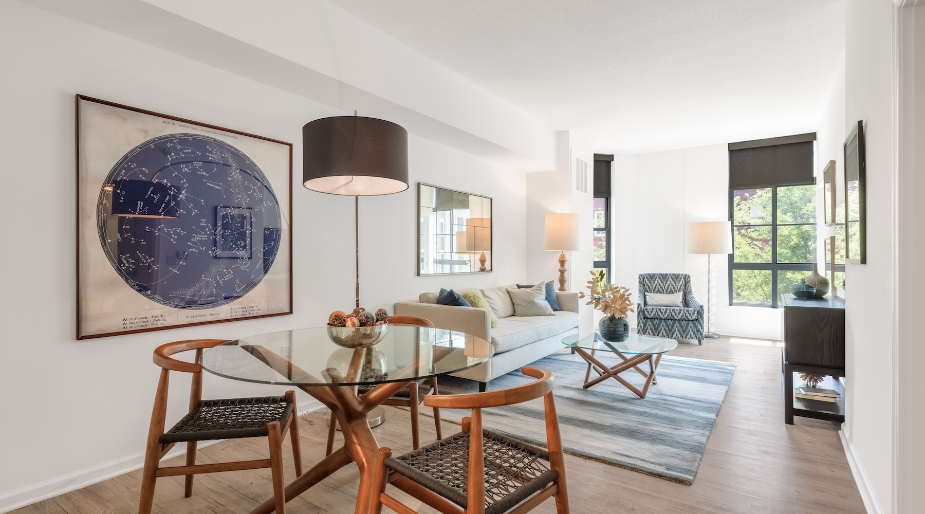 Beautiful living areas to match your lifestyle a living room with a couch and a dining table and chairs