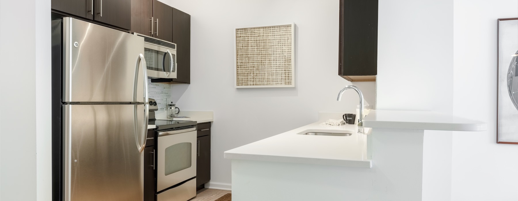 a kitchen with a refrigerator and stove