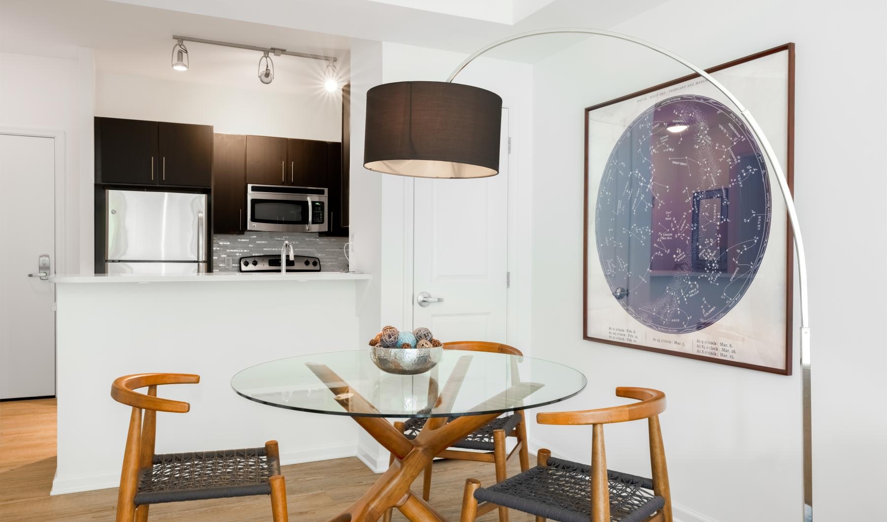 a kitchen with a table and chairs