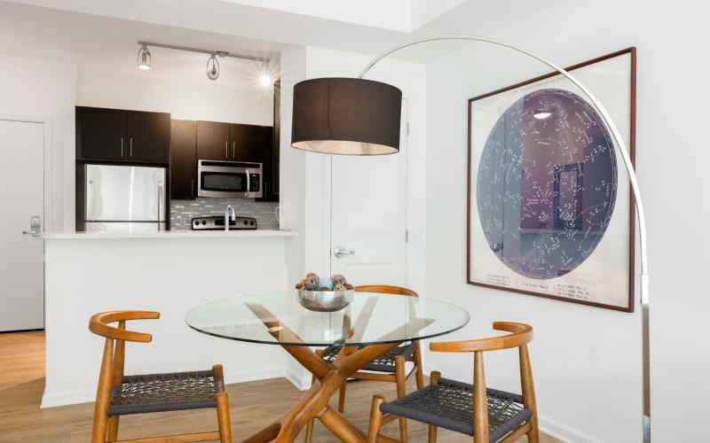 a kitchen with a table and chairs