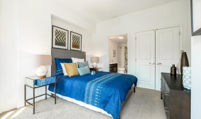Generous bedroom offerings to fit every family a bedroom with a bed and a desk