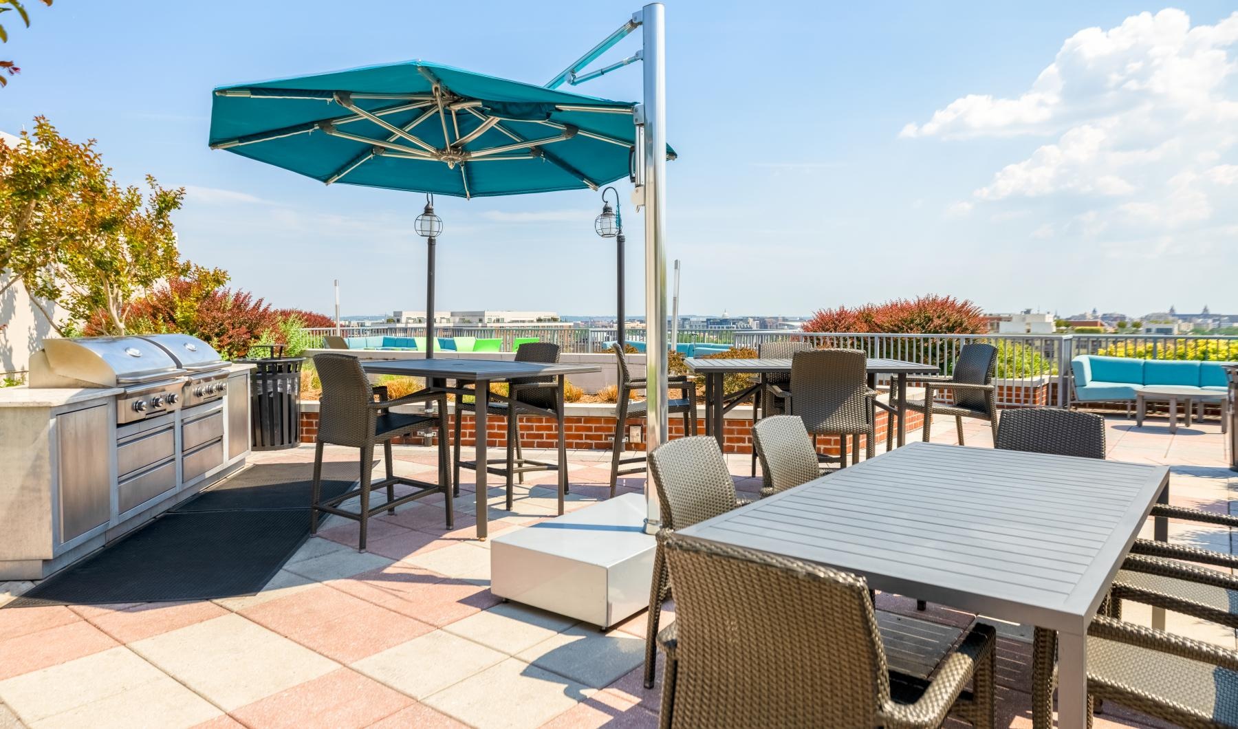 a patio with tables and chairs