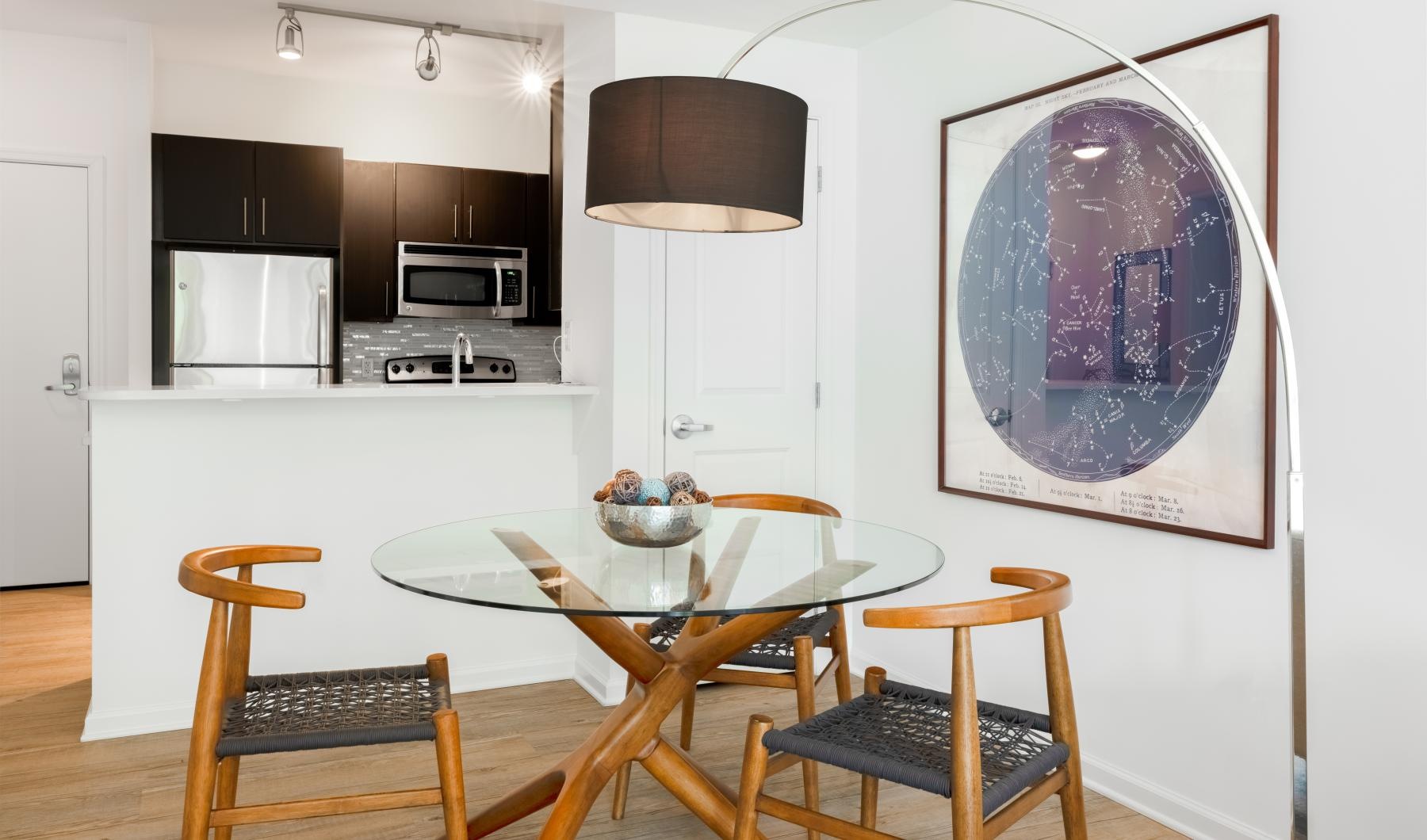 a kitchen with a table and chairs